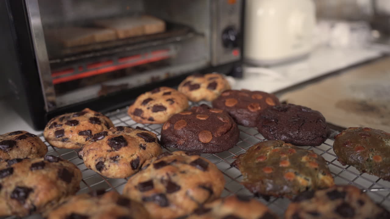 Tempting Assorted Cookies On A Cooling Rack Outside The Oven