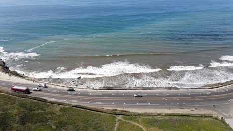 aerial-view-of-bus-crossing-by-beach