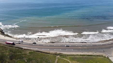 aerial view of bus crossing by beach