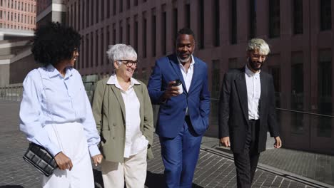 Diverse group of business people walking on a city street