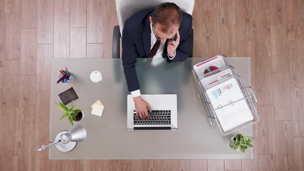Businessman working at desk with laptop
