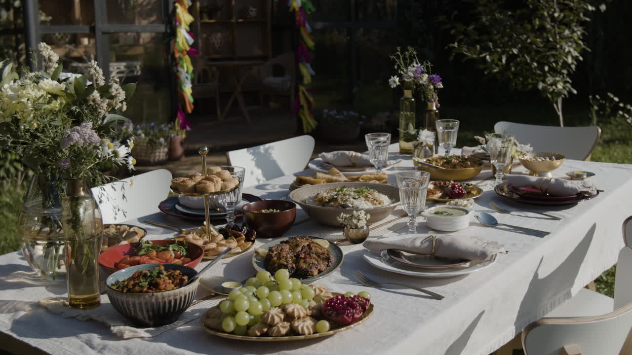 An elegantly set outdoor dining table in a garden for a special occasion
