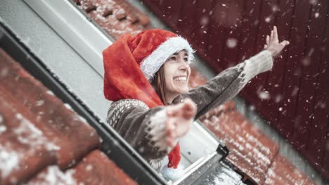 young woman happy of a snow in her rooftop room. still picture with moving snow. looping. cinemagraph.
