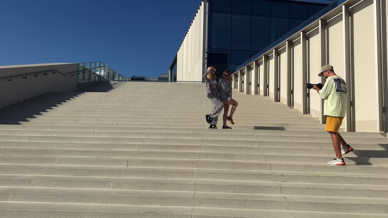 People on Stairs near a Building