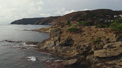 Drone-shot-flying-along-coastline-in-Cap-de-Creus-peninsula-in-Spain