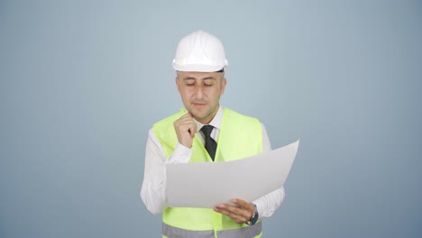 engineer looking at camera and making positive gesture.