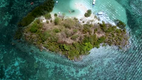 Aerial-top-down-view-of-CYC-Beach-on-CYC-Island,-Coron-town,-Philippines