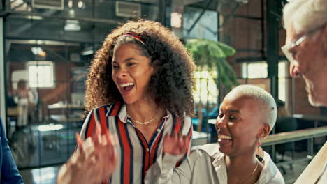 diverse team celebrating success in modern office