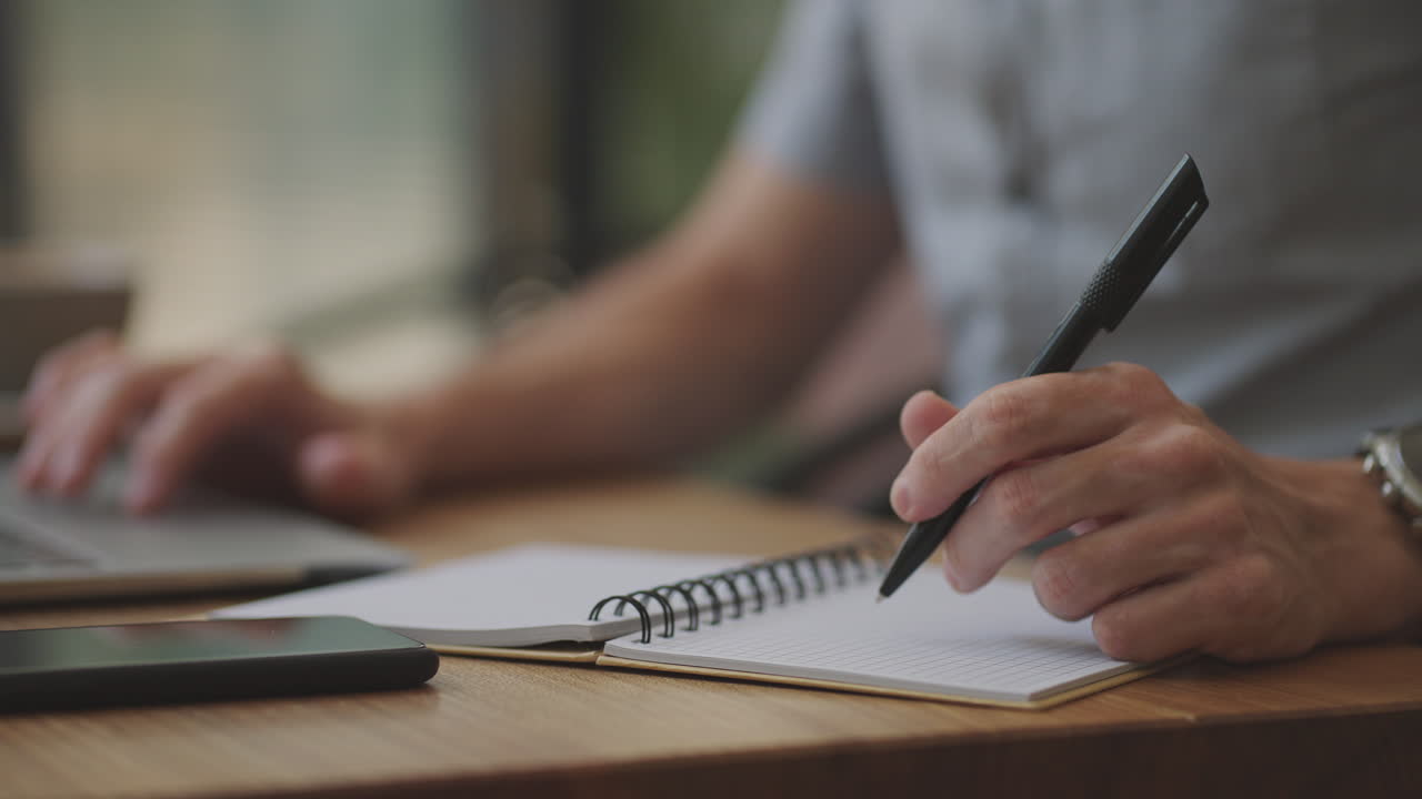 beautiful male developer or student working studying by laptop in cafe. freelance remote work online education self employed