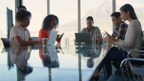 business executives sitting at table and working in modern office 4k