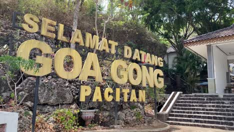 welcome sign at the entrance gate before heading to the gong cave in pacitan, east java, indonesia.