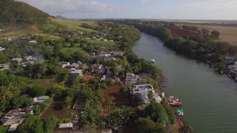 flying over the town and river on mauritius island