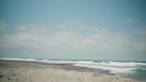 Beautiful-Scenic-Beach-with-Ocean-Waves-Rolling-onto-the-Sand-in-La-Union,-Philippines