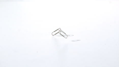 paper clips falling on the floor