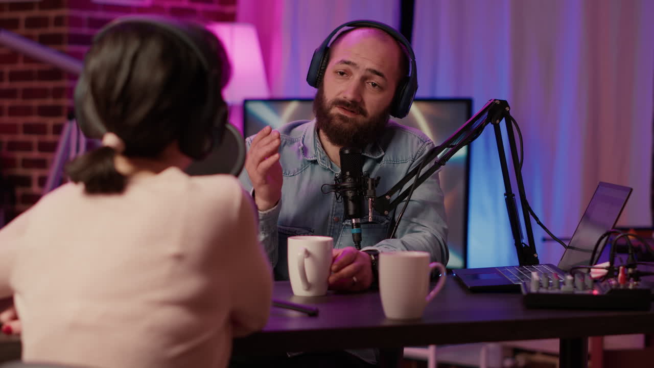 Man and woman having casual conversation and drinking coffe or tea in online podcast