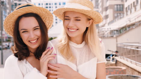 two women laughing in the city