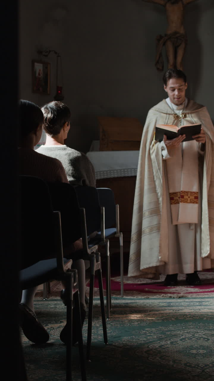 A priest reading to a congregation in a church