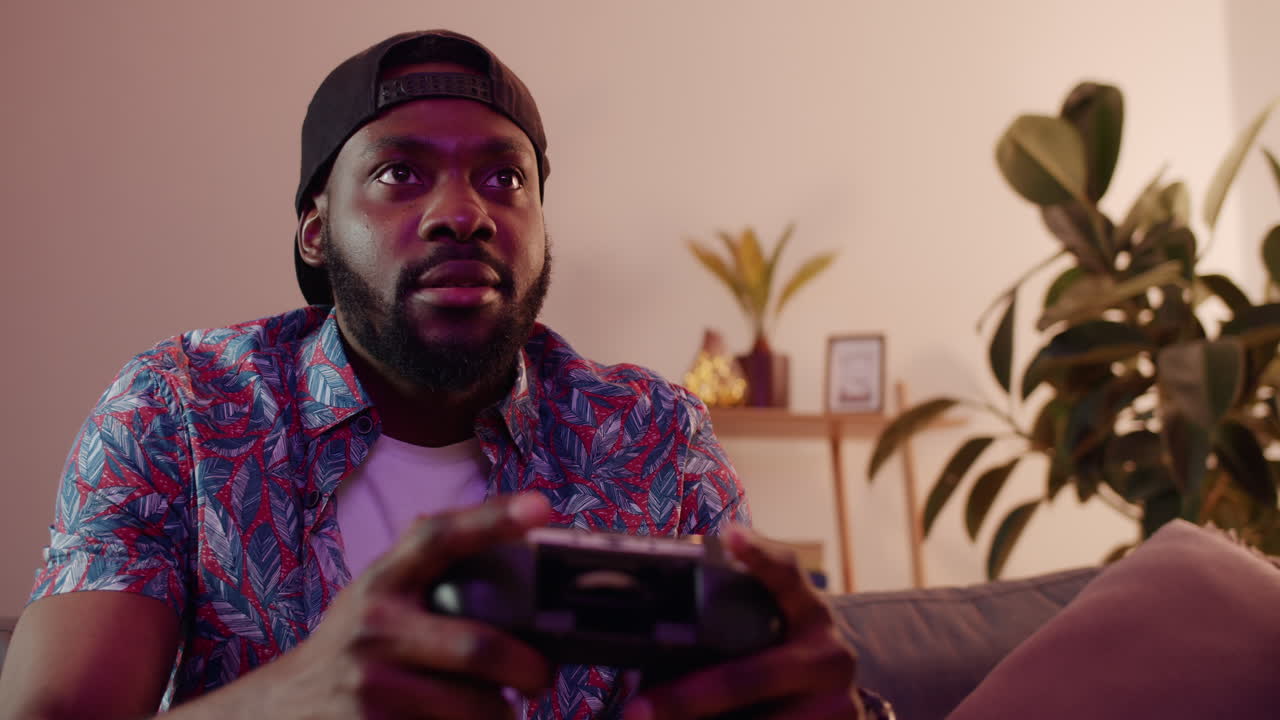 Man playing video games at home