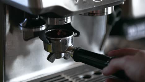 a-man-starts-grind-espresso-beans-in-an-automatic-espresso-machine-in-1080p-60fps