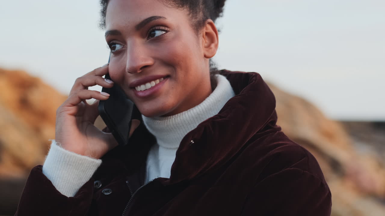 African American girl talking on mobile phone.