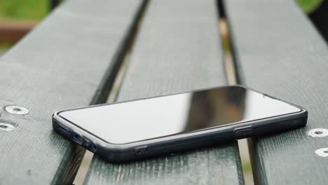 forget smartphone on a park bench, lost smart phone ,