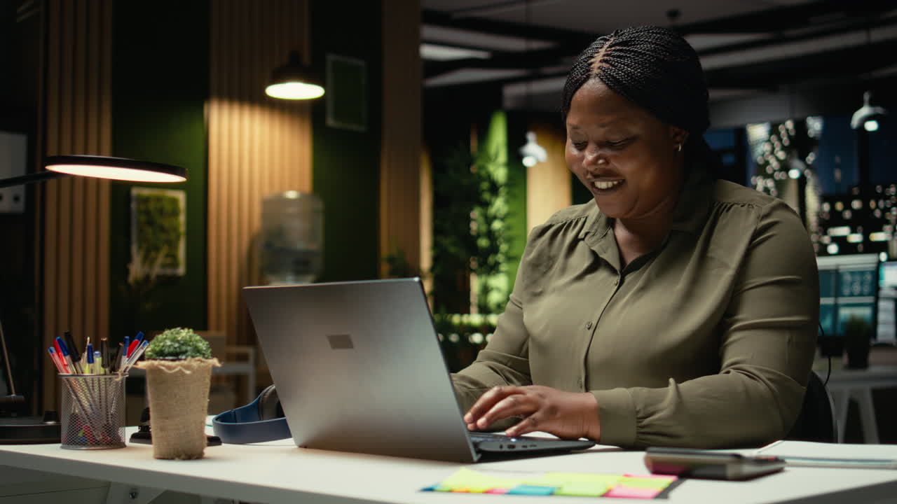 Genius black employee making a breakthrough discovery after hours