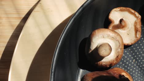 cooking shiitake mushrooms in a pan
