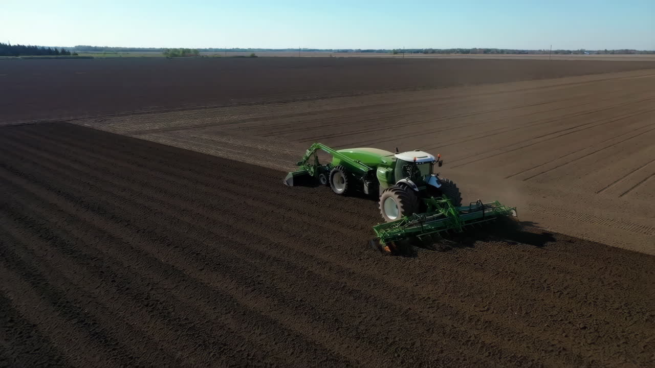 Tractor Preparing a Field for Planting