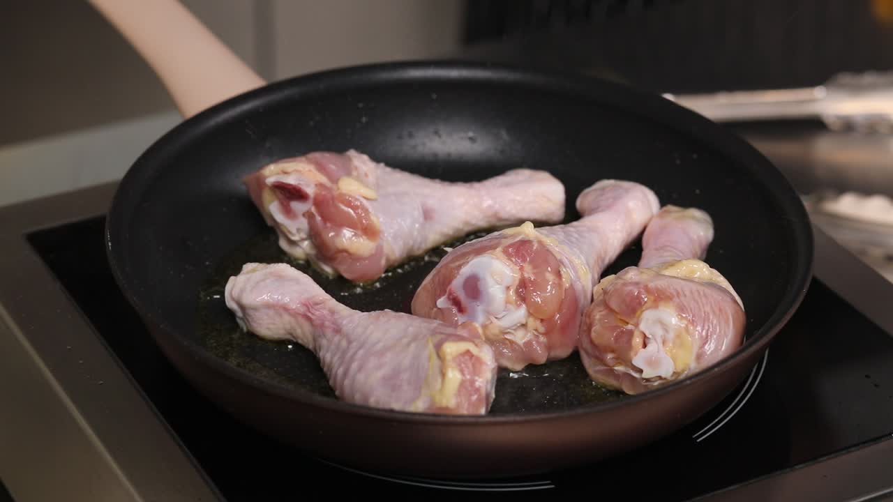 Frying Chicken Drumsticks in a Pan