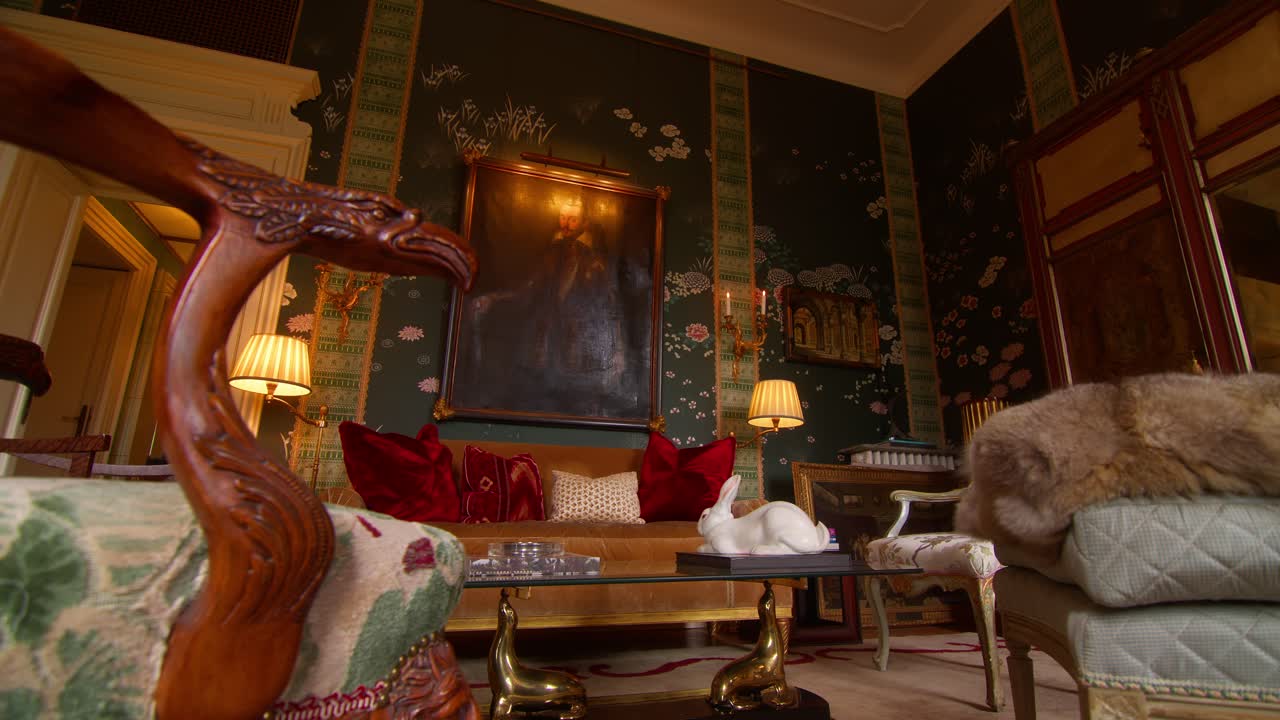 Panning right shot revealing classical living room with elegant interior design in a Milan apartment, Italy, highlighting refined decor and style