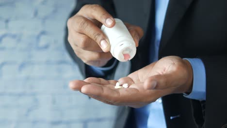 businessman taking pills