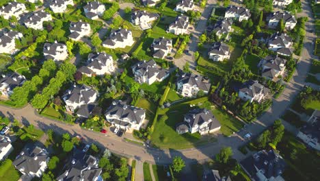 Aerial-view-of-residential-houses-neighborhood-and-apartment-building-complex-at-sunset