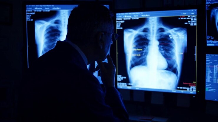 Doctor Silhouette Before Chest X Ray Wall, Dark Radiology Suite