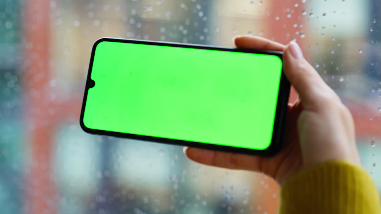 Fingers using touchscreen mockup smartphone making online purchase closeup