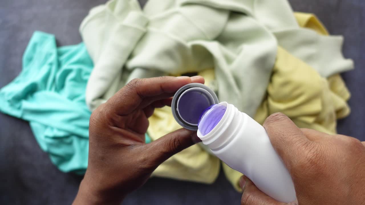 Applying Laundry Detergent to Clothes