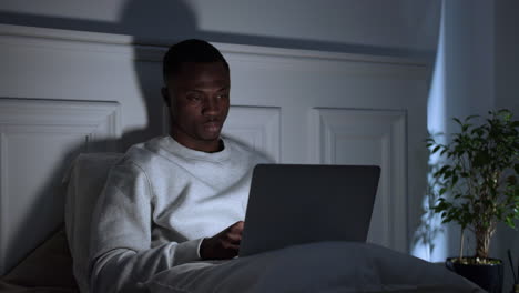 young tired man on bed