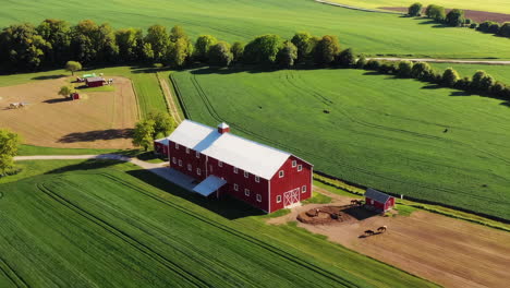 aerial view of a red barn on a farm