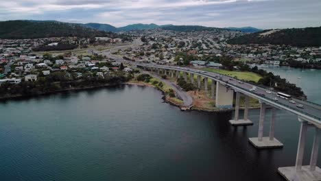 Aerial-view-of-a-crowded-city-with-bridge-in-foreground