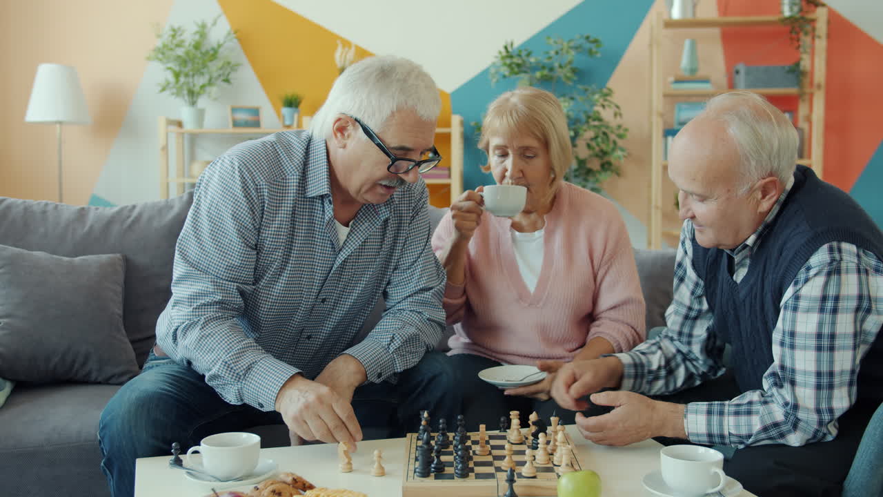 Senior Friends Enjoying Chess and Tea