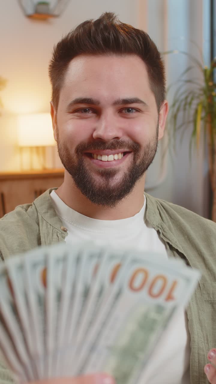 Successful rich young caucasian man holding dollar bill money fan ...