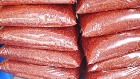 stacked bags of red chili powder