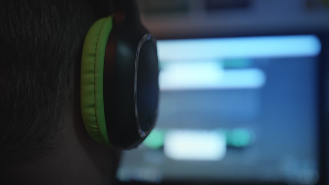 Person Wearing Headphones Listening to Music or Working on Audio