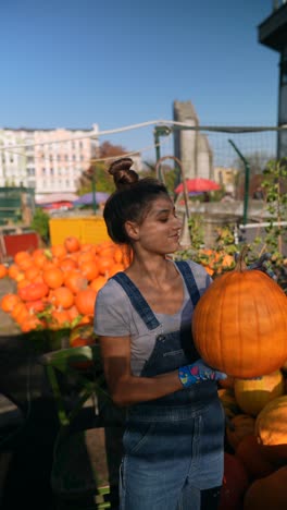 woman holding a pumpkin