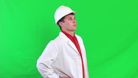 construction worker looking up at building