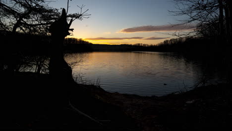 sun setting over a lake