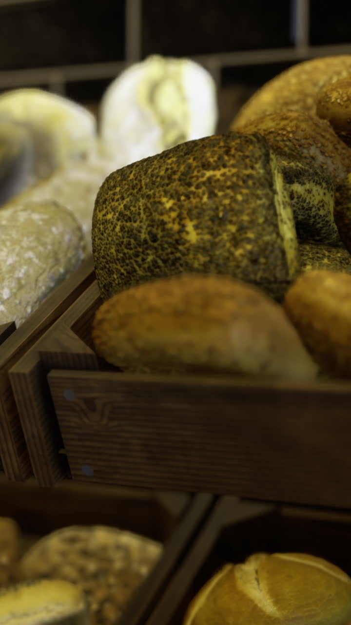 Freshly baked bread displayed in wooden boxes at a local bakery