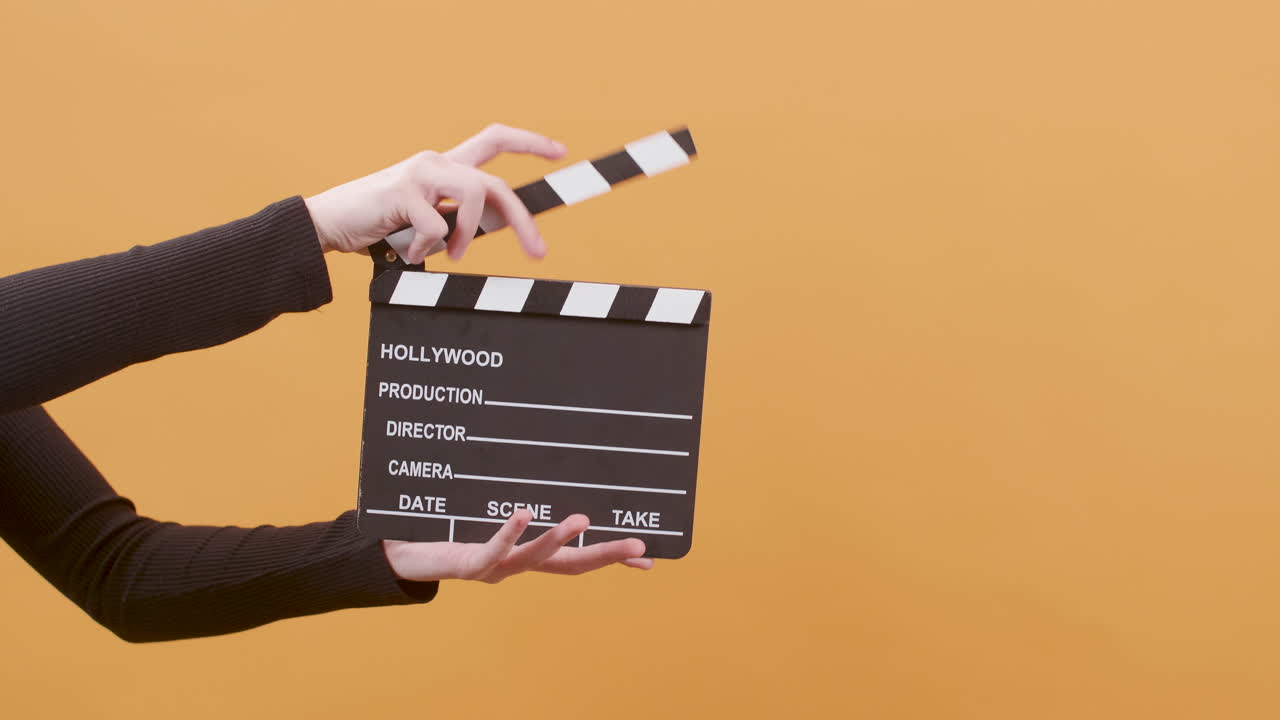 Clapperboard in hand