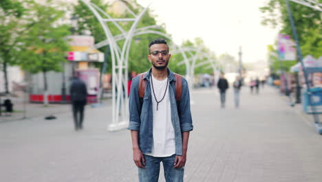 man standing on a city street