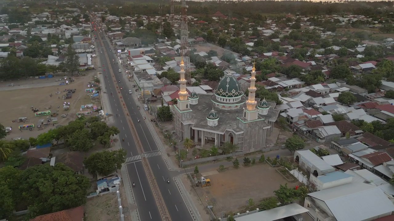Local Village Mosque In Tanjung Lombok Indonesia Drone Pull Back Rise At Sunset 4K 30FPS