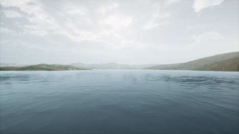 lake in hills on summer day